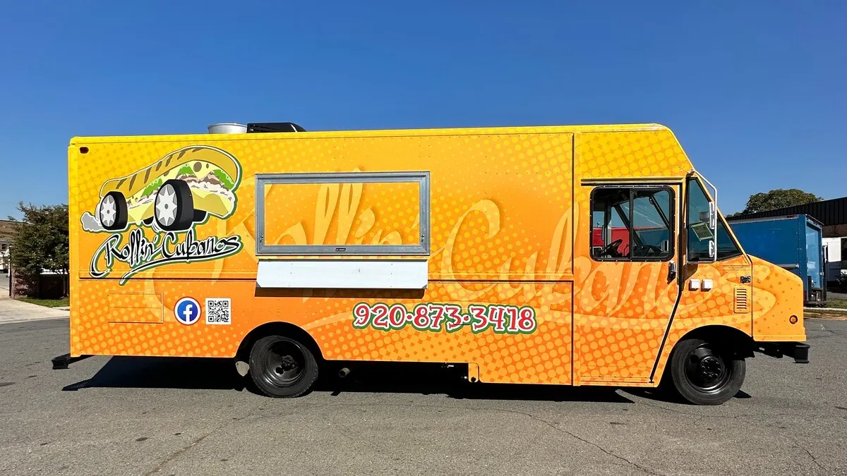 Yellow food truck designed by Al Haj Company
